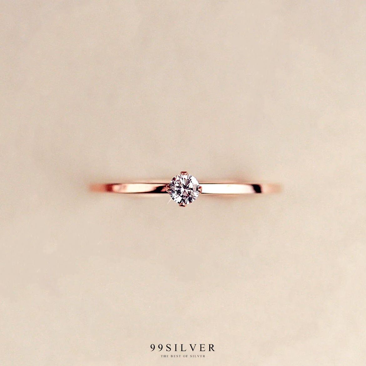 แหวนสแตนเลสแท้ชุบพิ้งโกลประดับเพชร Cz Swiss แท้ 1 เม็๋ด แบบชู ก้านจิ๋ว 1 มิลลิเมตร 