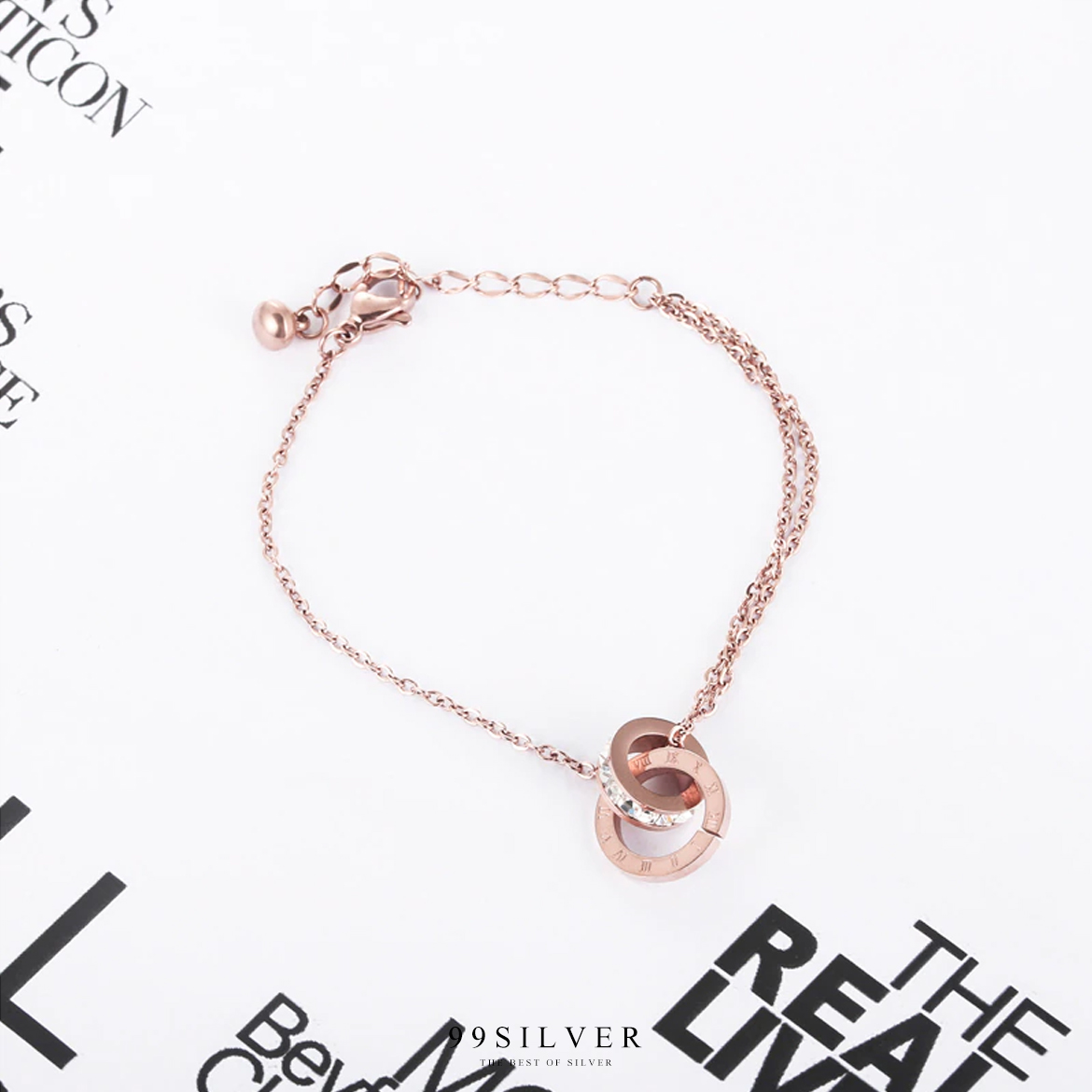 สร้อยข้อมือสแตนเลสสีพิงค์โกล ประดับจี้เป็นชาร์มทรงกลม bvlgari มีเลขโรมันที่่ตัวจี้