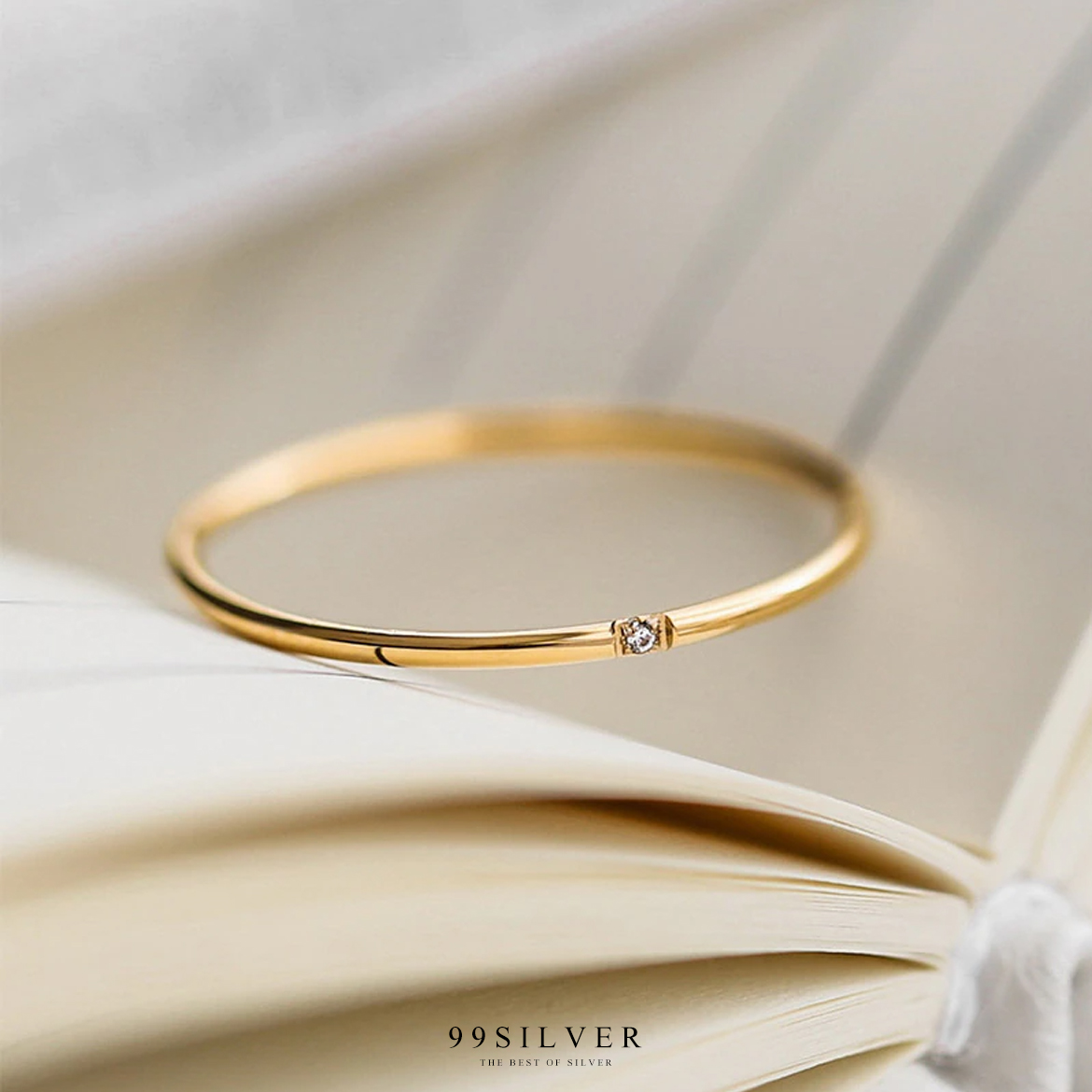 แหวนสแตนเลสแท้ชุบทองตัวเรือนกลมจิ๋ว 1 มิลลิเมตร ประดับเพชร Cz Swiss แท้ 1 เม็๋ด