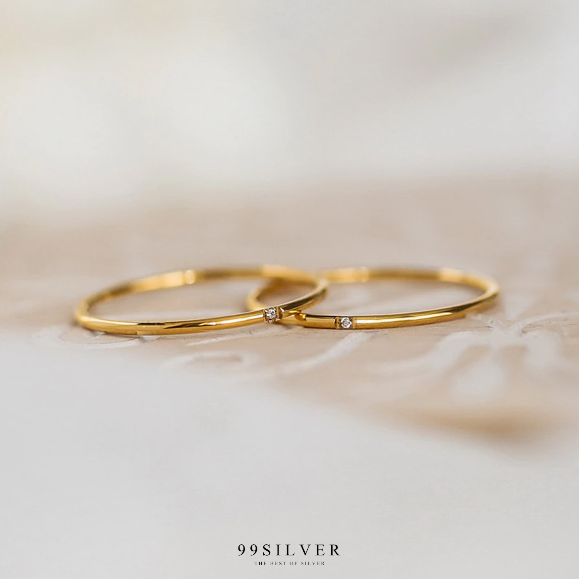 แหวนสแตนเลสแท้ชุบทองตัวเรือนกลมจิ๋ว 1 มิลลิเมตร ประดับเพชร Cz Swiss แท้ 1 เม็๋ด