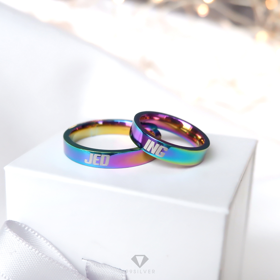 แหวนสแตนเลสไทเทเนี่ยมแท้ หน้ากว้าง 4 มิลลิเมตร ผิวเงาเรียบ ไดร์ฟสีรุ้งไทเท